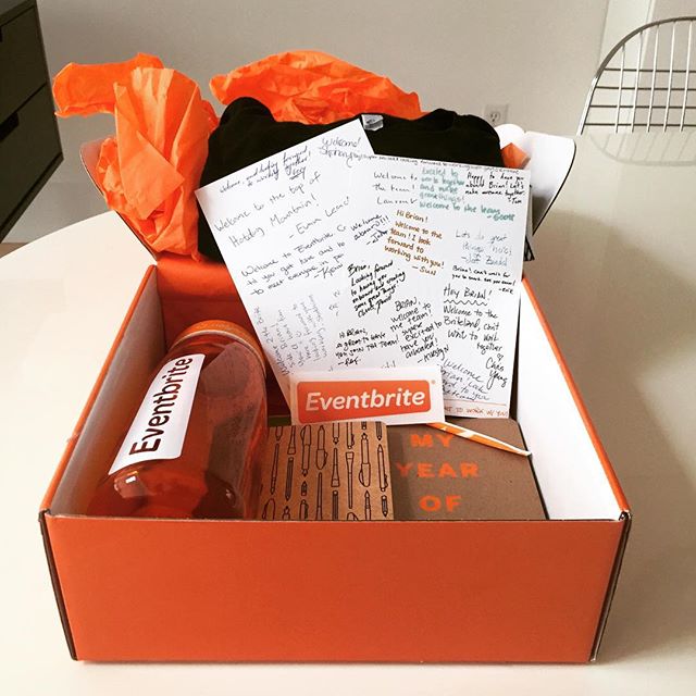a opened box contains writing and orange tissue