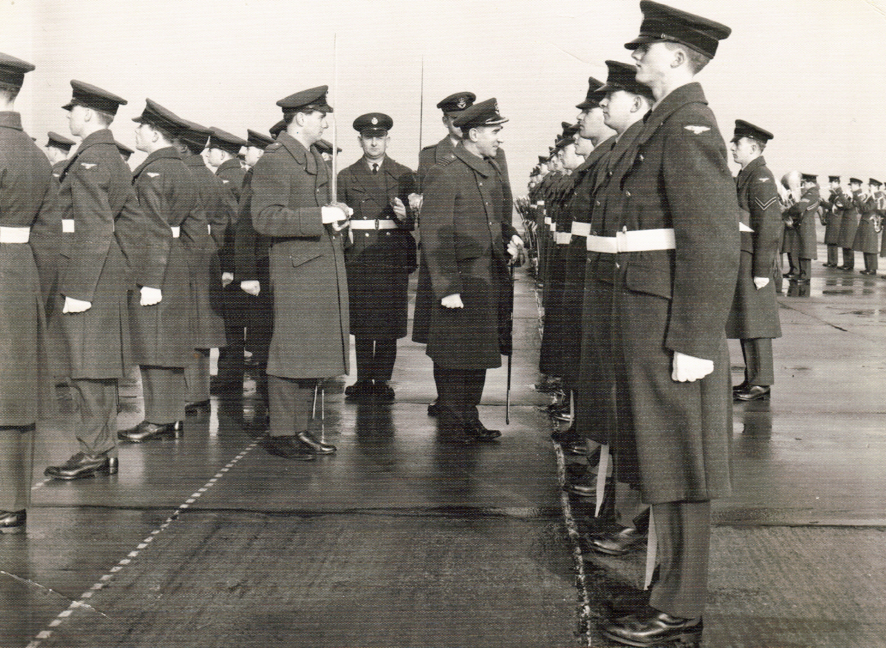 men in uniform standing and conferring at the military ceremony