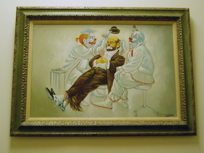 a painting of two clowns in the middle of a room