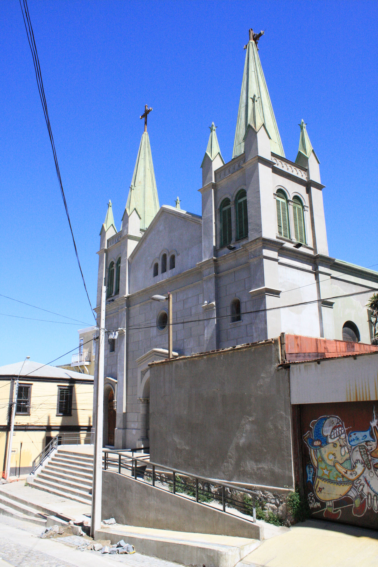 a cathedral in a small city that looks like it has graffiti on the walls