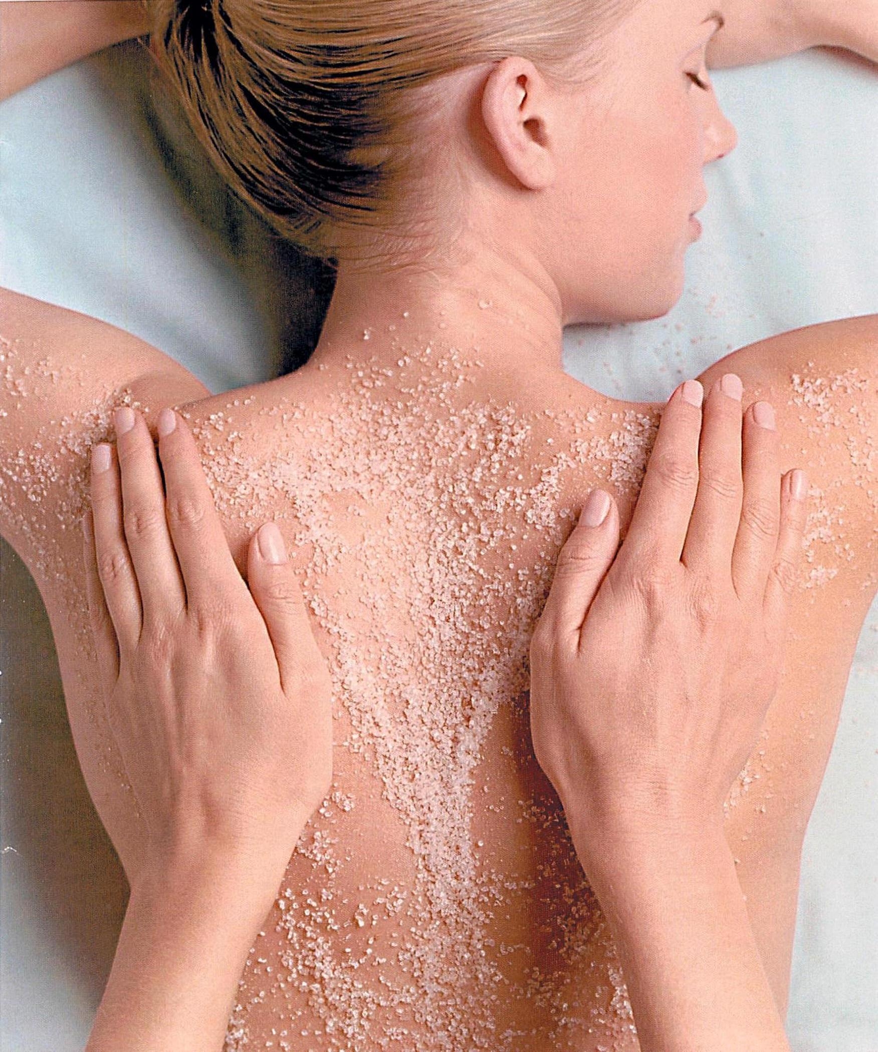 a girl with powder on her back that is spread out