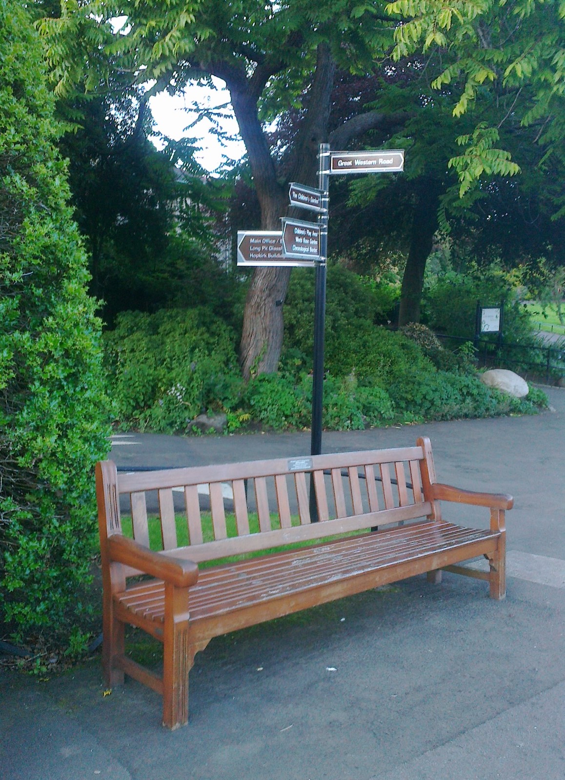 a wooden bench that is in the street