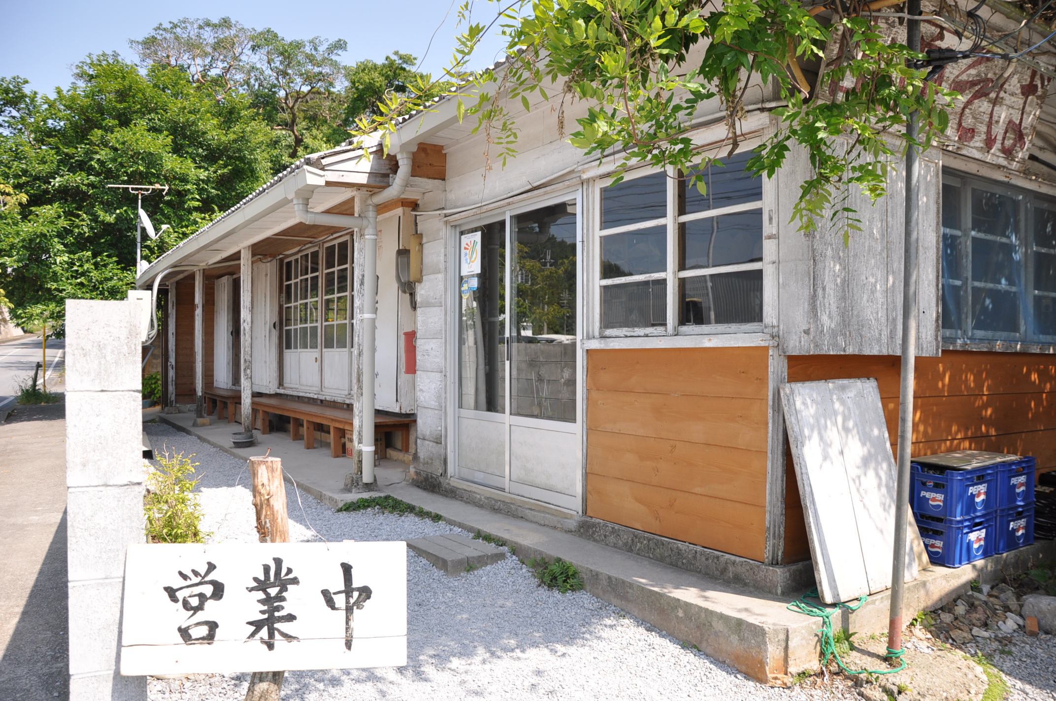 a sign in front of a wooden building