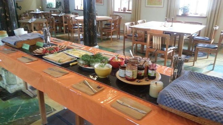 a buffet table is covered in assorted food items