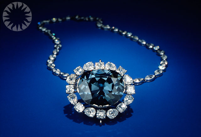 an intricately designed blue diamond set necklace