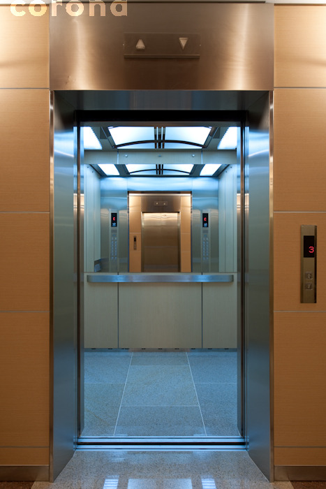 a tall lift door with some sliding doors