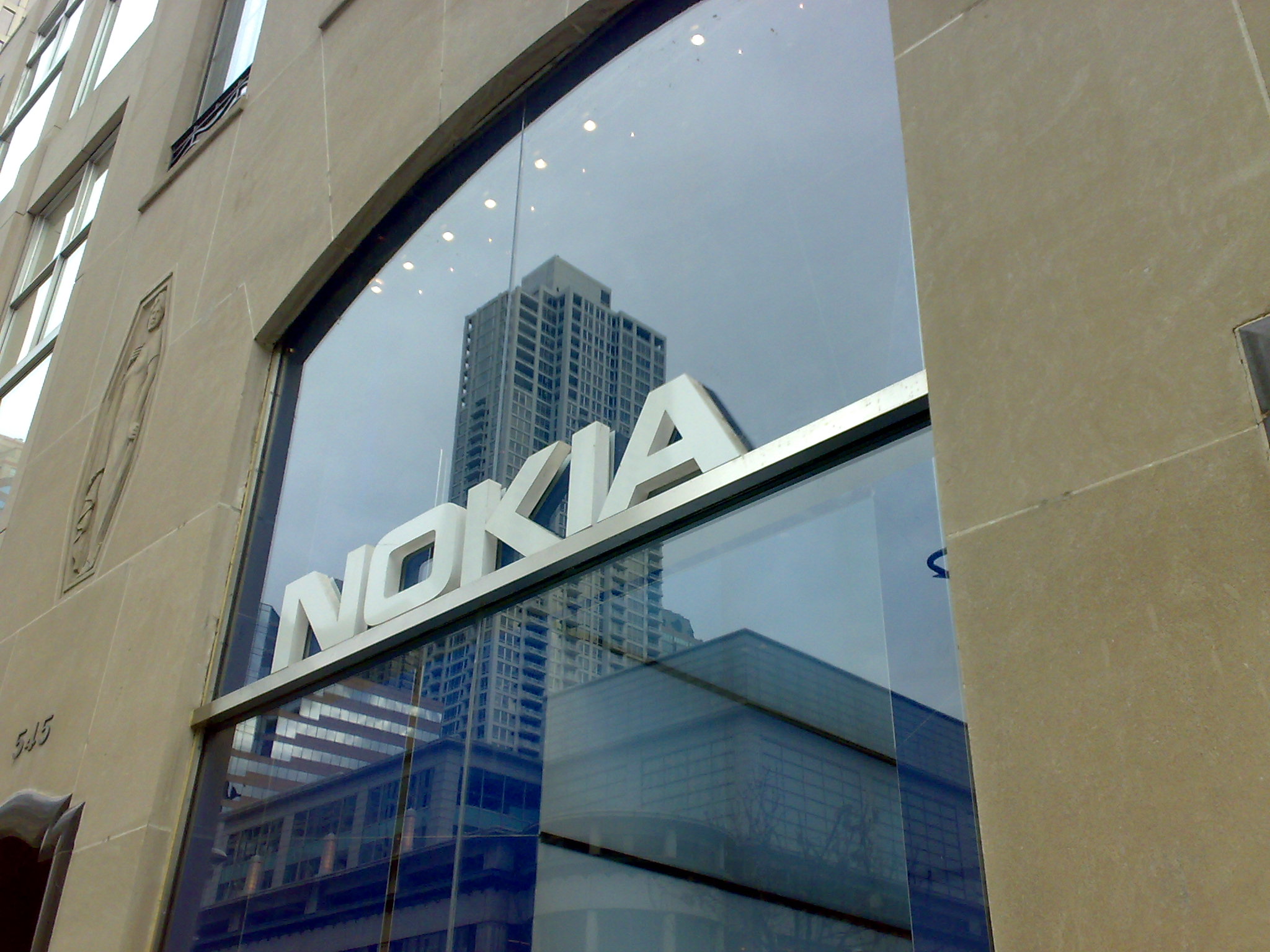 the nokia logo is reflected in a glass wall