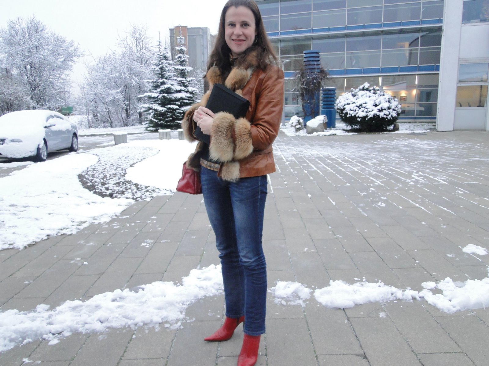 a woman with her hands in the pockets of her jacket while walking