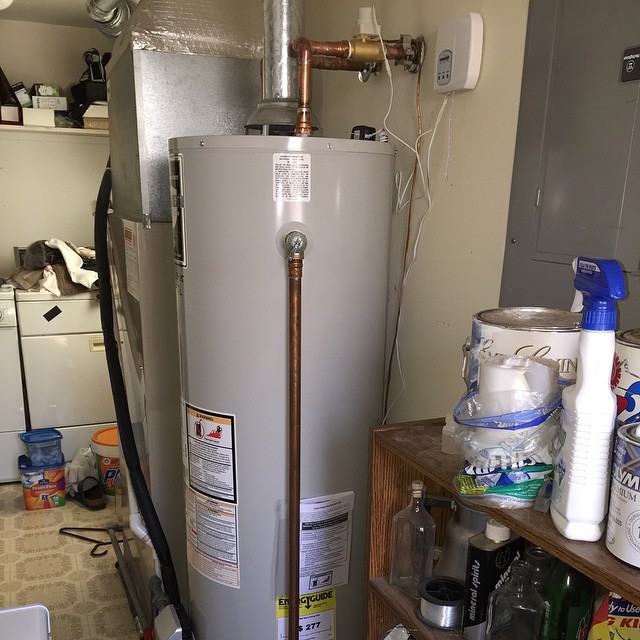 an water heater is next to several products