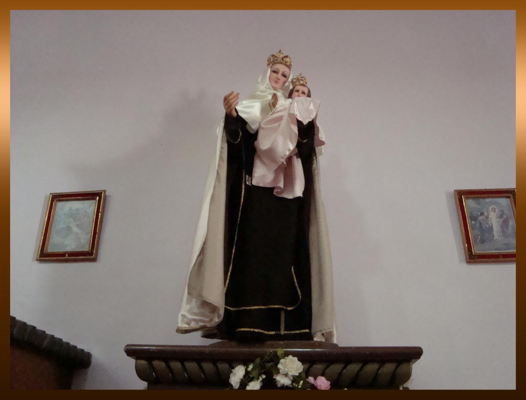 this is an image of a statue of st mary and baby jesus