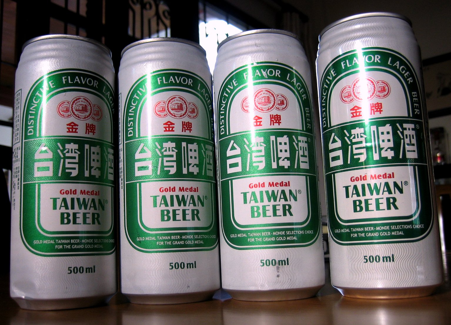 a bunch of cans of taiwan beer on a table