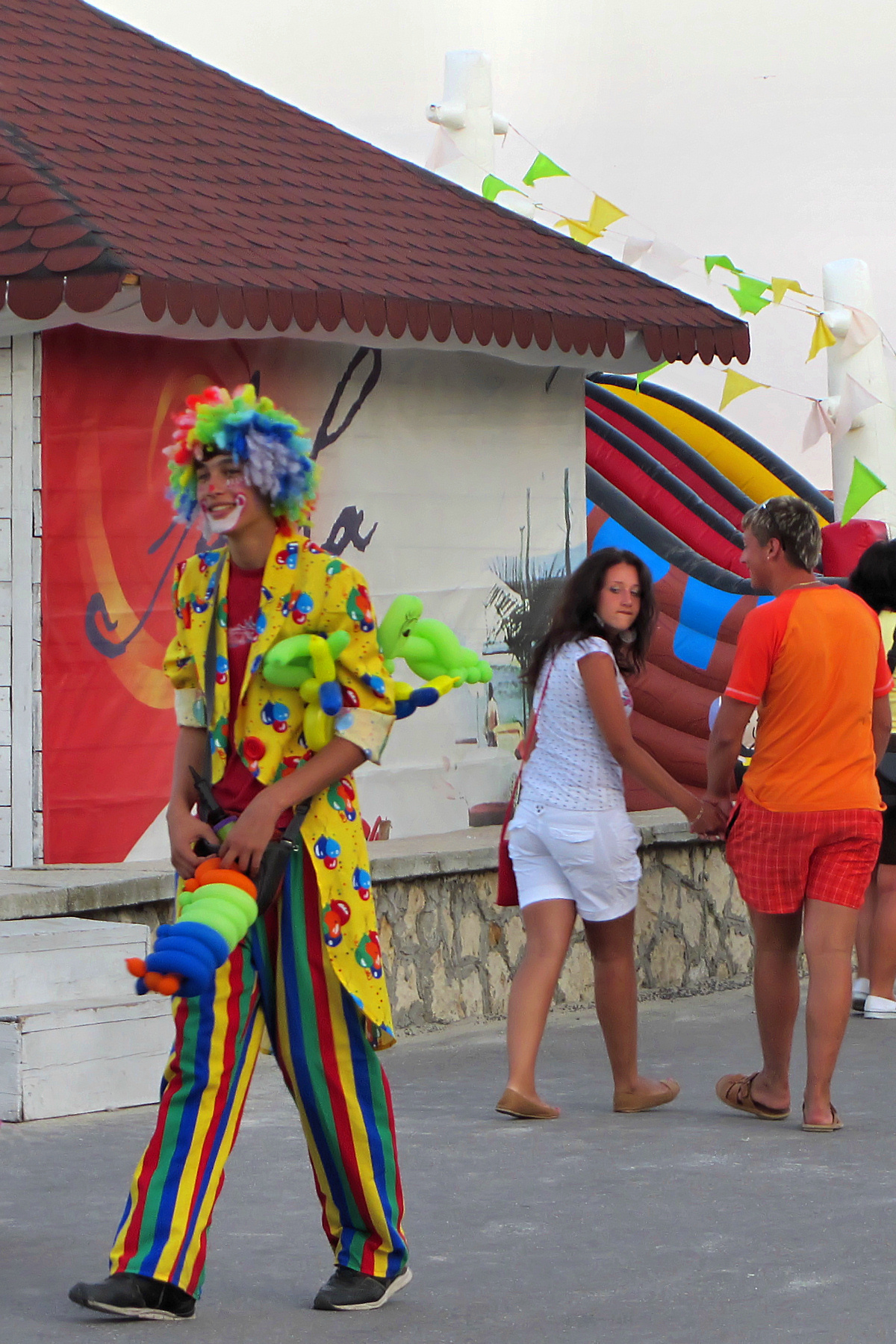 a clown in the midst of a group of people