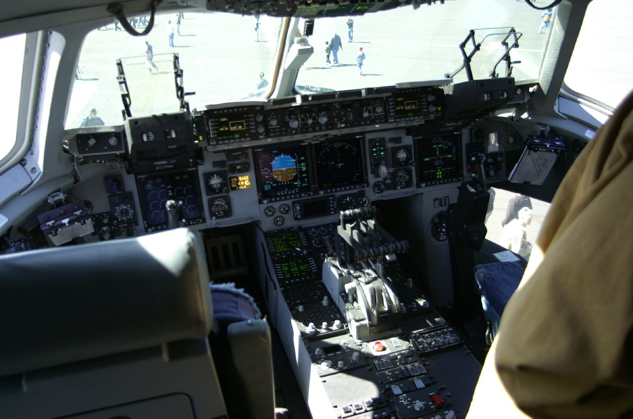a pilot is in his seat at the controls of a plane