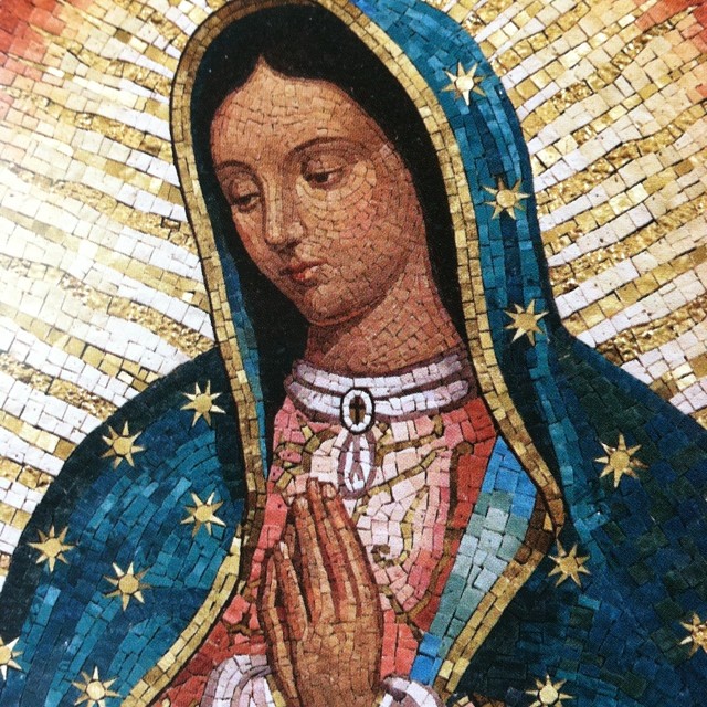 mosaic of mary of lou in blue dress holding hands together