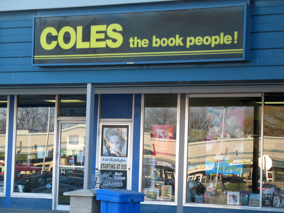 a book store that has the window glass on one of its front windows