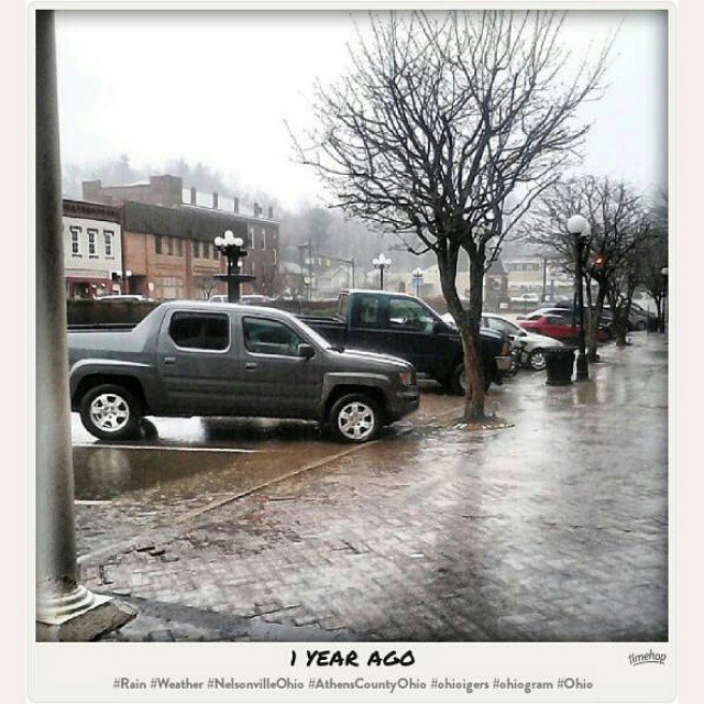 an image of a very wet parking lot that has cars in it