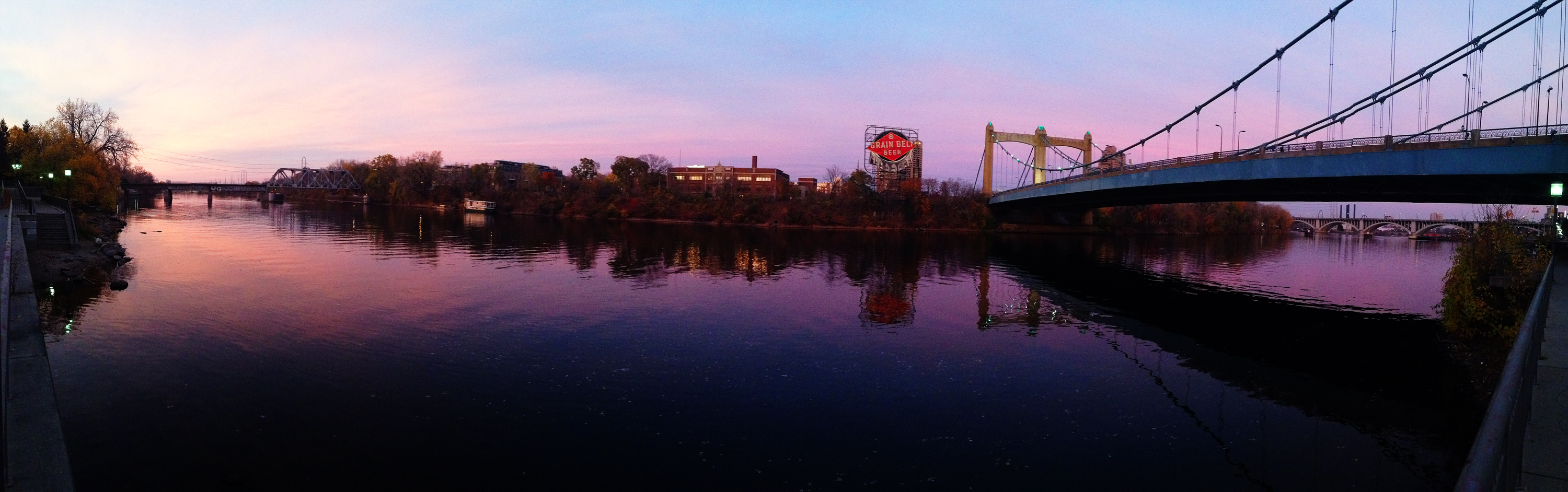 a bridge that has a red stop sign above it