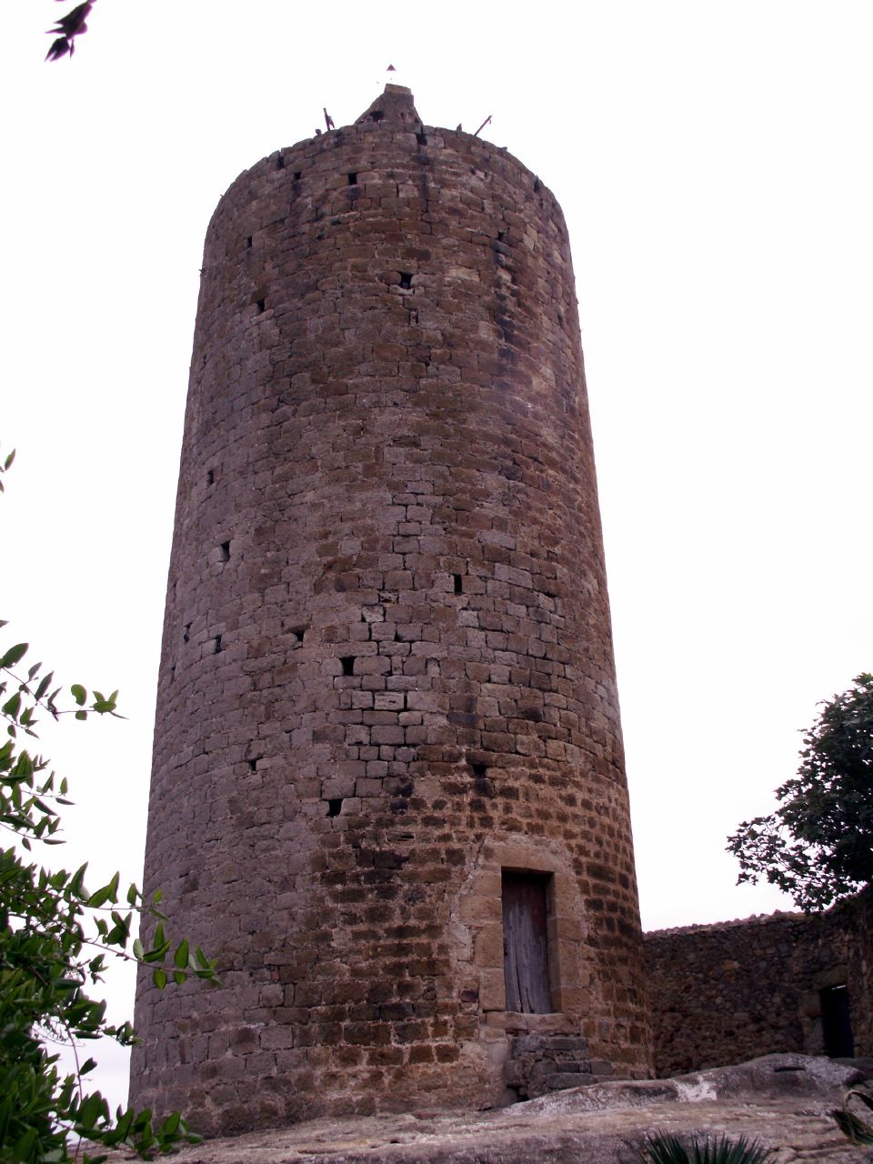 an old brick tower with birds on it