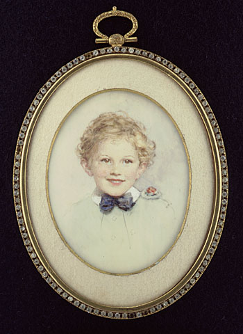 an old po portrait of a child with a bow tie
