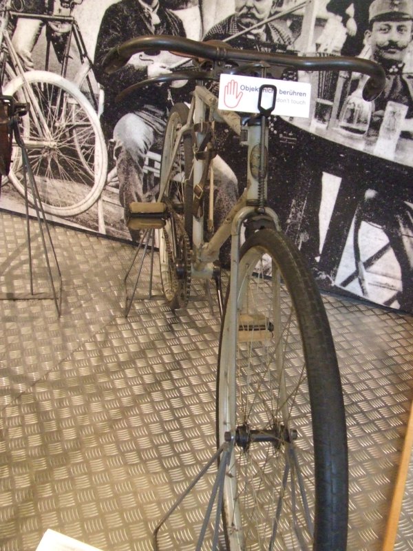 an old bicycle on display in a museum