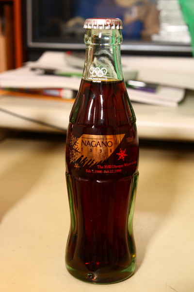 a bottle of wine sits on a counter