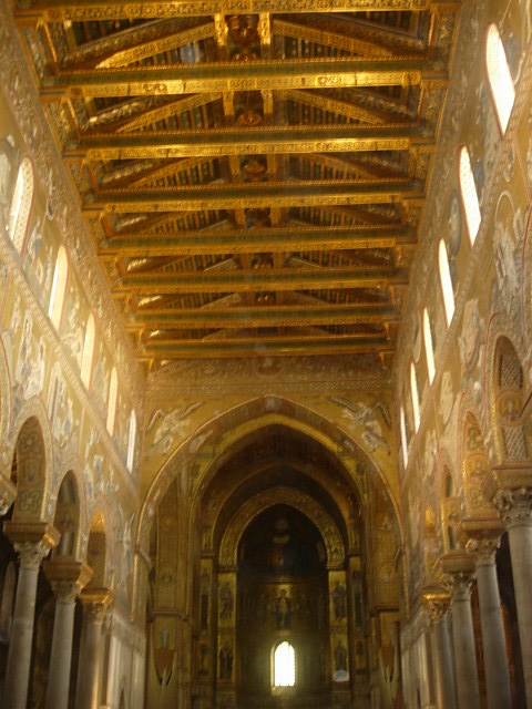 a church with gold - decorated ceilings and columns