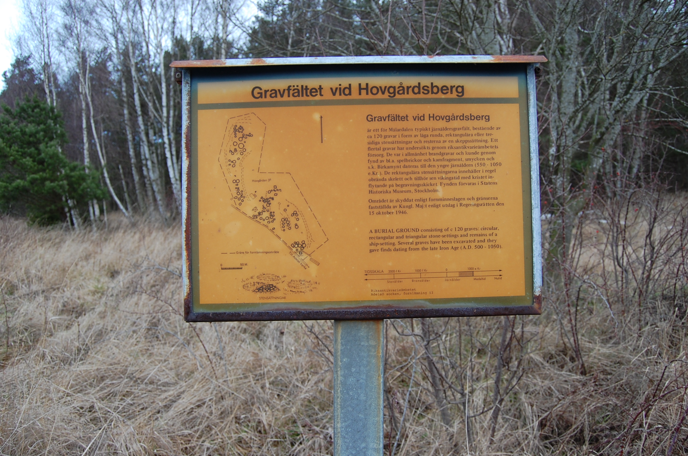 a sign in a forest indicating directions to various places