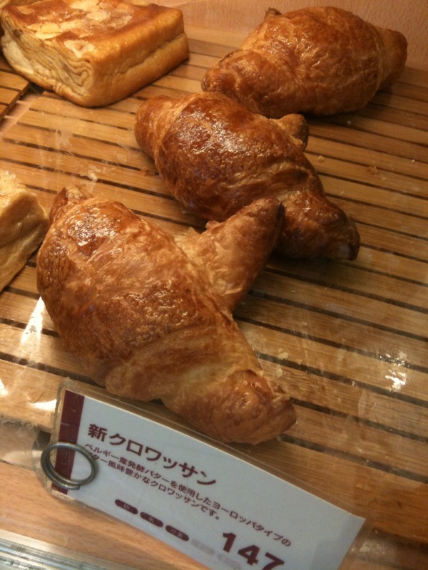 a number of pastries sitting in plastic wrappers