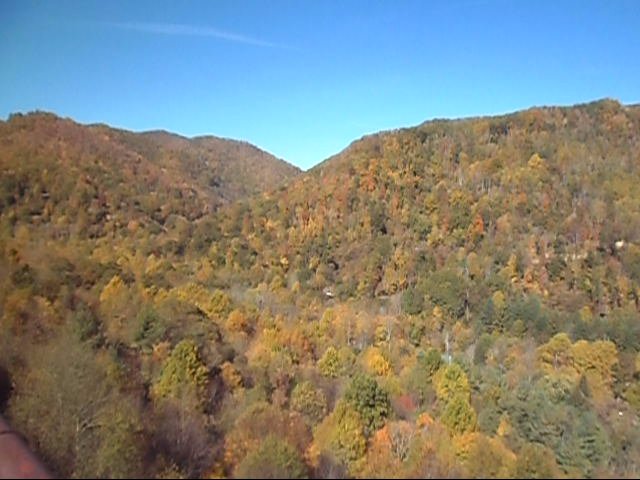 a train traveling on tracks in the mountains