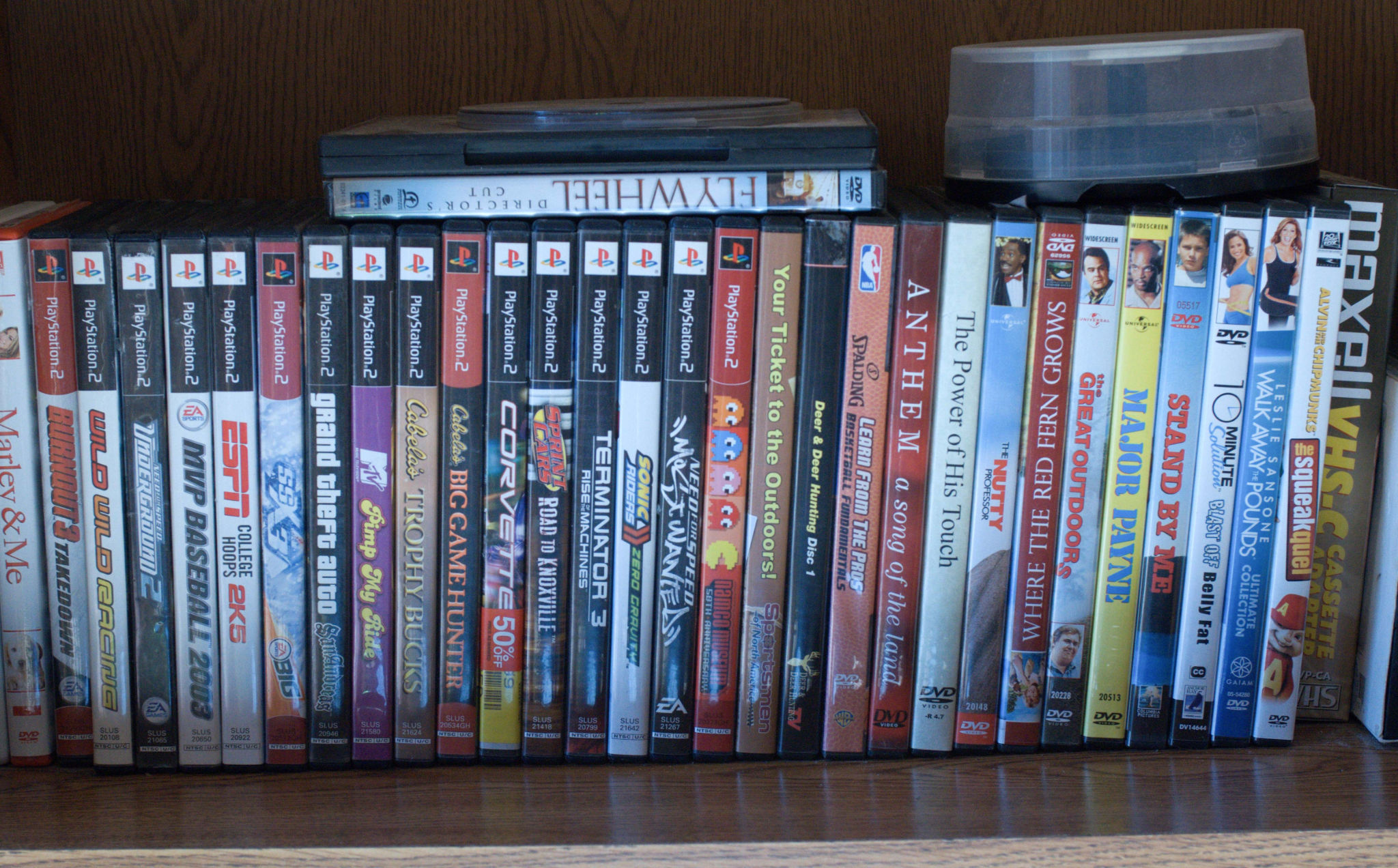 a lot of dvds that are sitting on the shelf