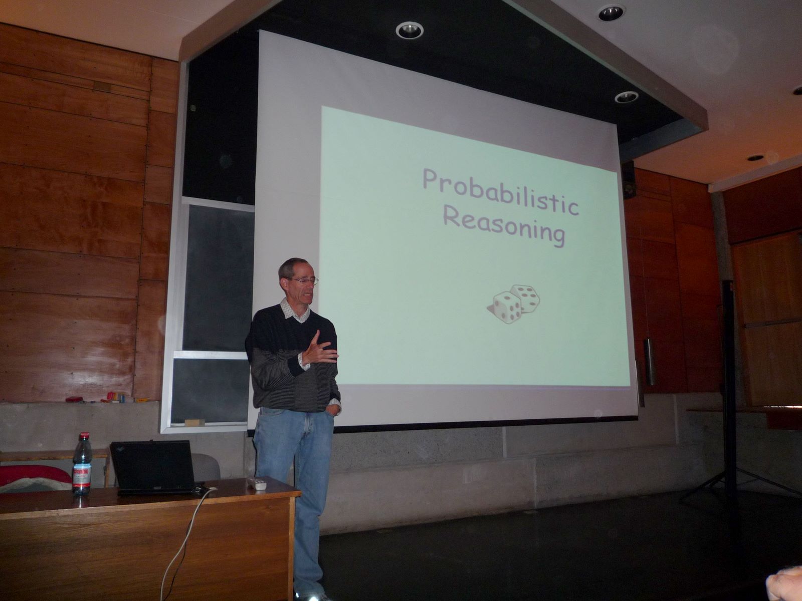 a person standing in front of a projection screen