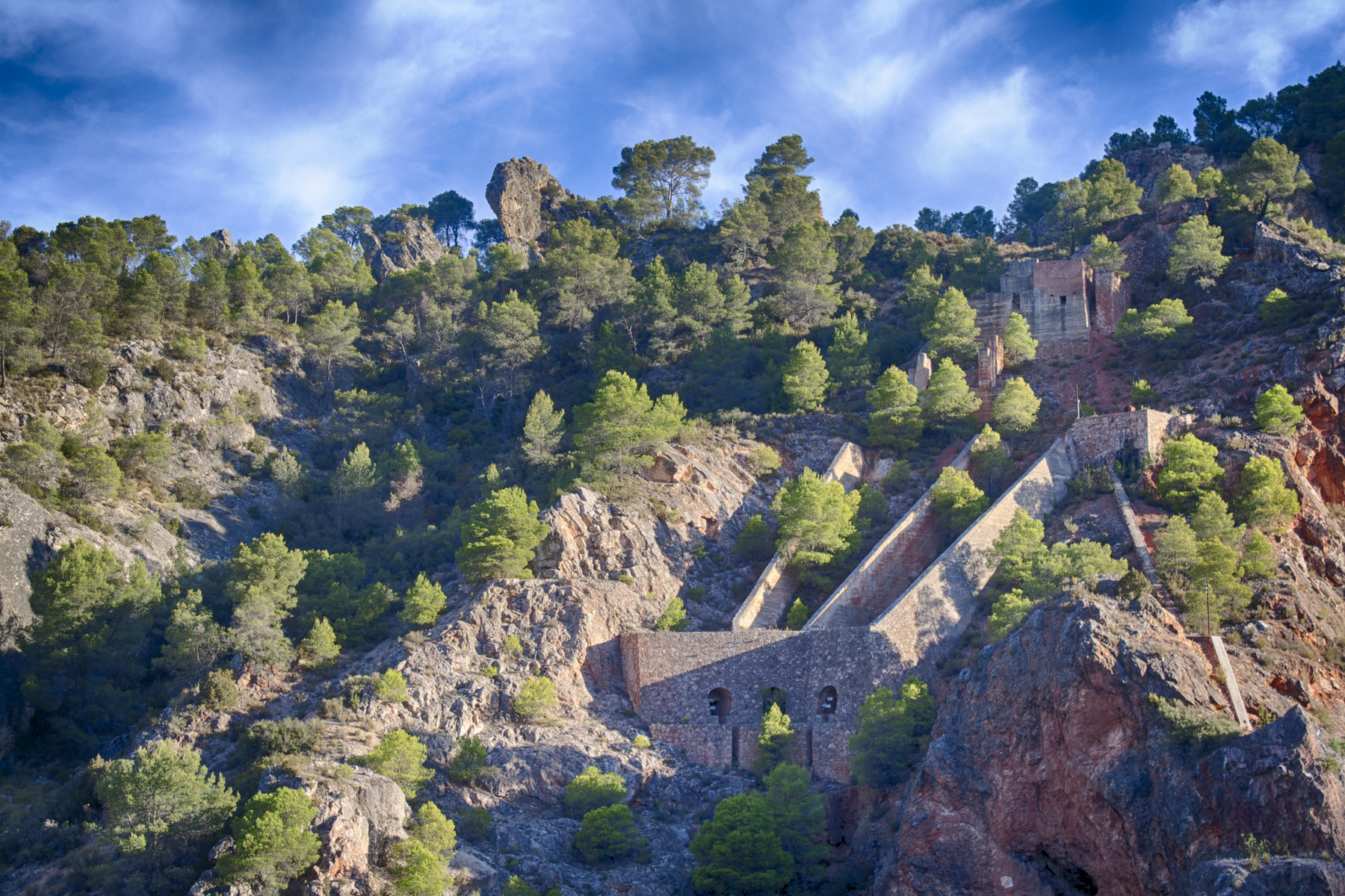 a small castle built into the side of a cliff