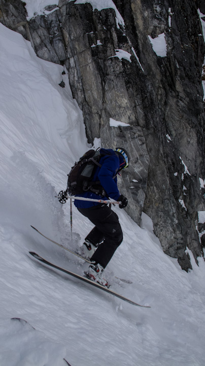 the skier has jumped through the air on his skis