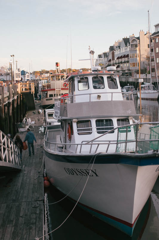 two boats docked next to each other on a pier