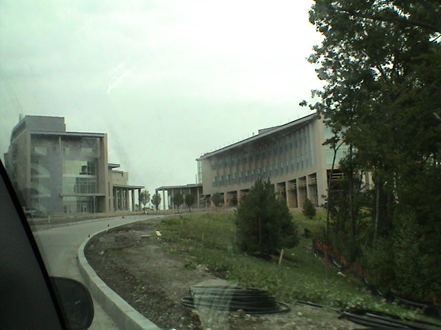 the road is a curve in front of many buildings