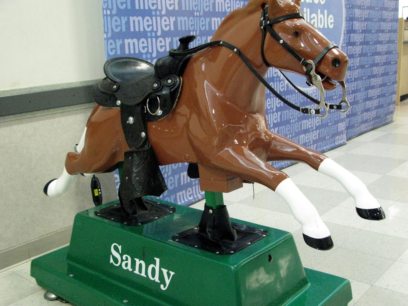 this horse is made of plastic and has a rider on its back