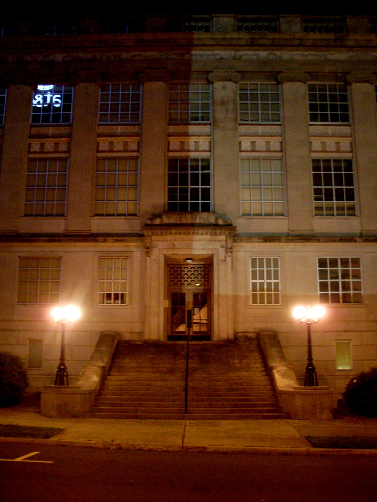 a large building with three lights on the front