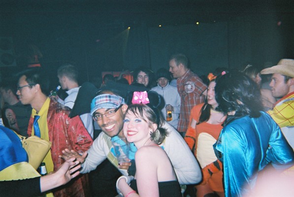 a group of people at a disco dancing