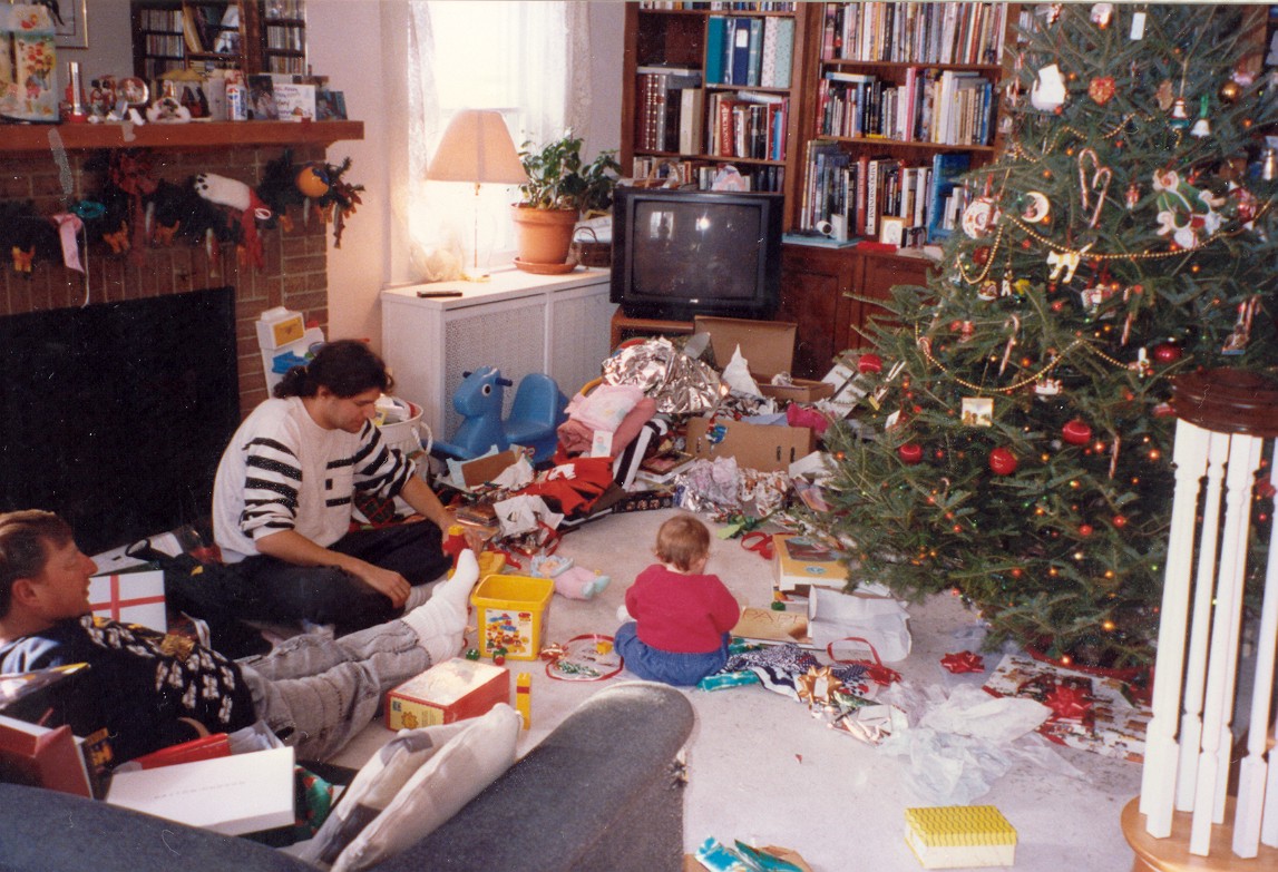 three people playing with toys while sitting on the floor