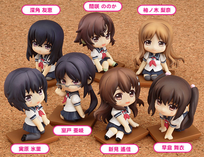 eight little anime dolls with tags on them