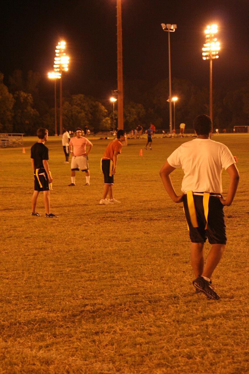 a soccer team practicing their drills at night
