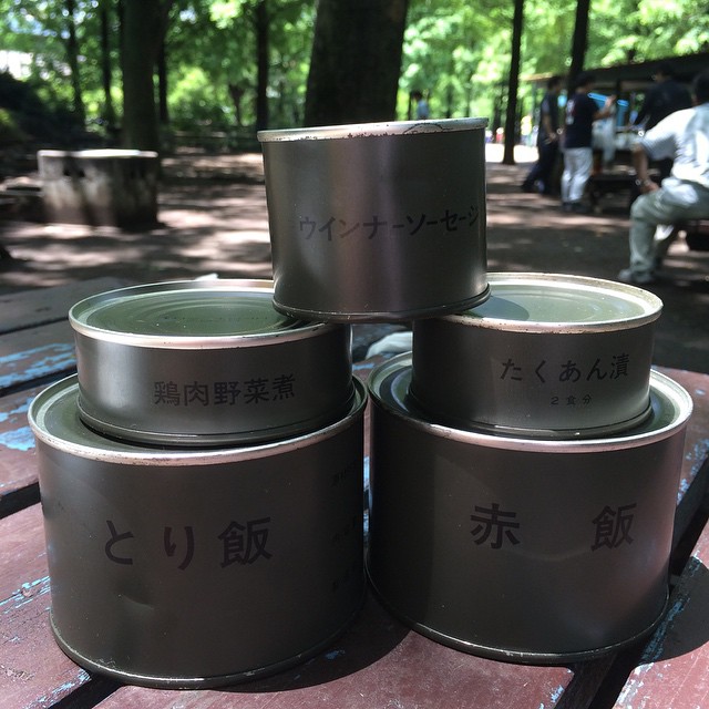 a stack of metal containers sitting on a bench