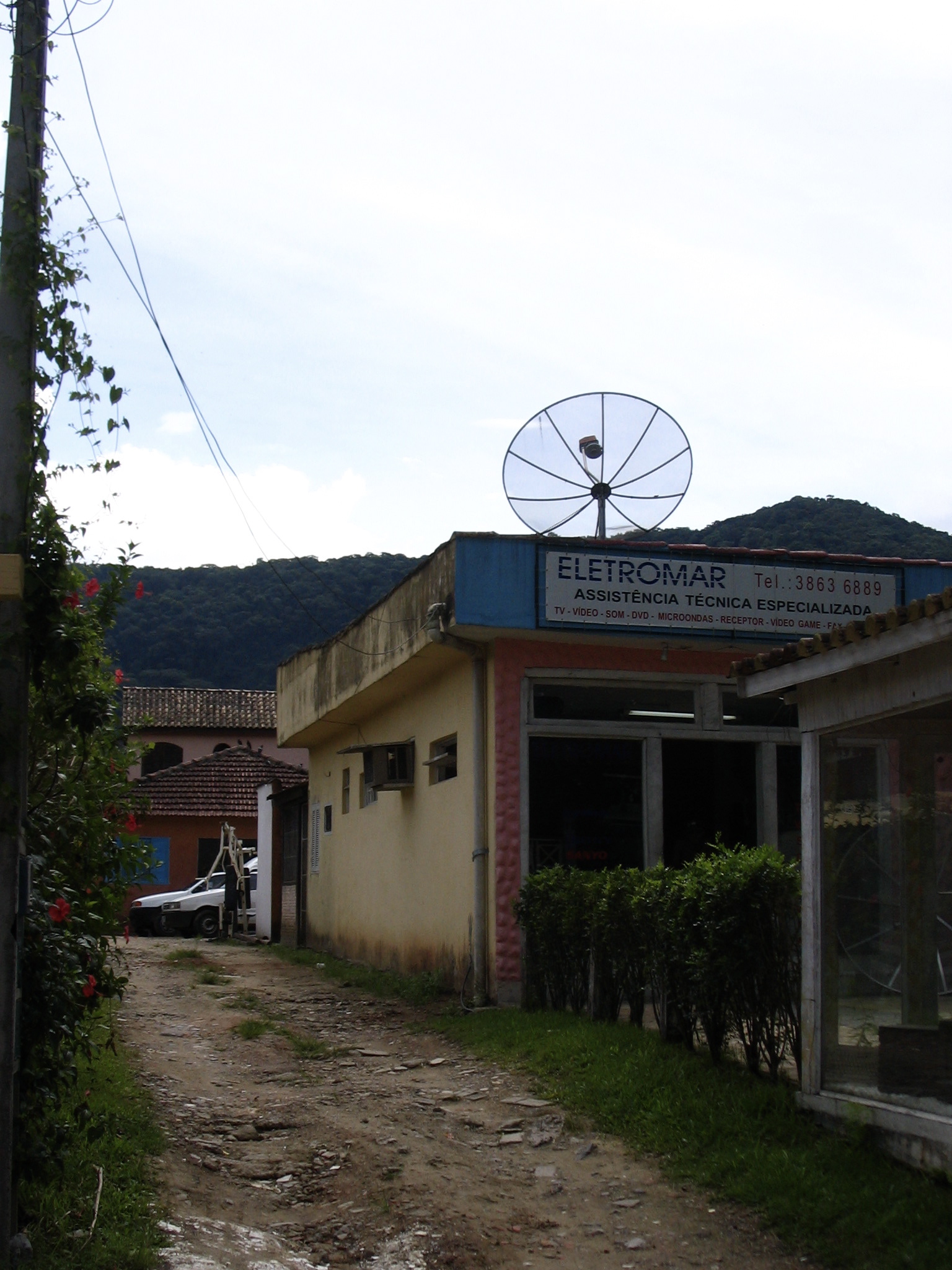 old fashioned building with satellite dish in a small street