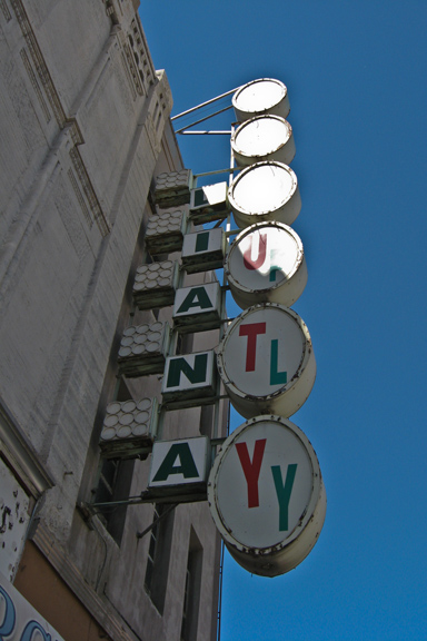 several street signs on display outside a building