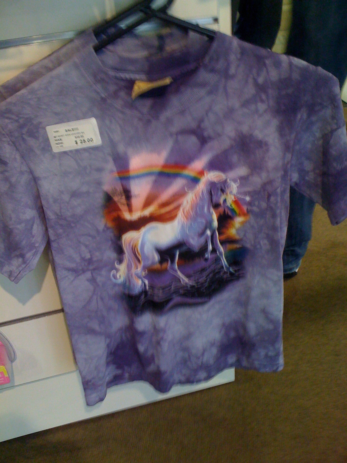 this is a tie dye shirt with a unicorn and rainbow