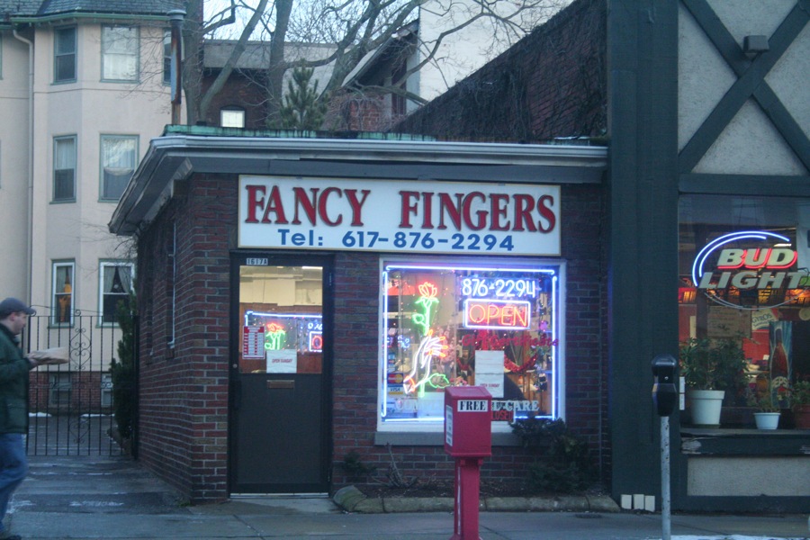 a store front with the word fancy fingers on it