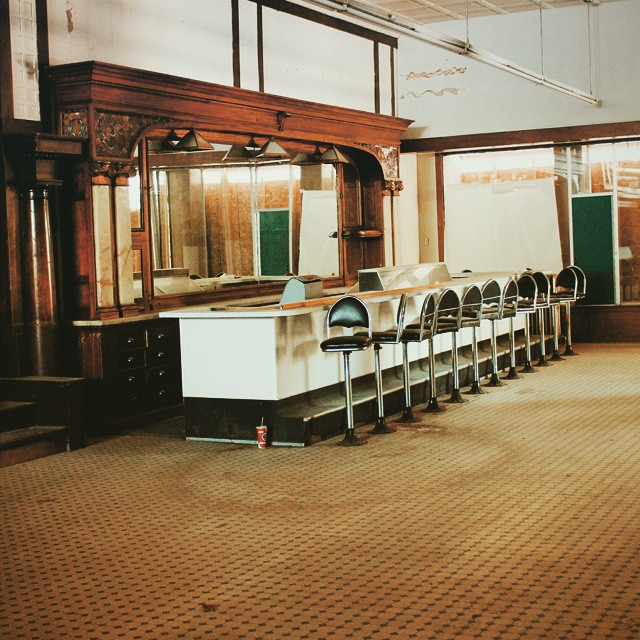 empty tables and chairs in a public room