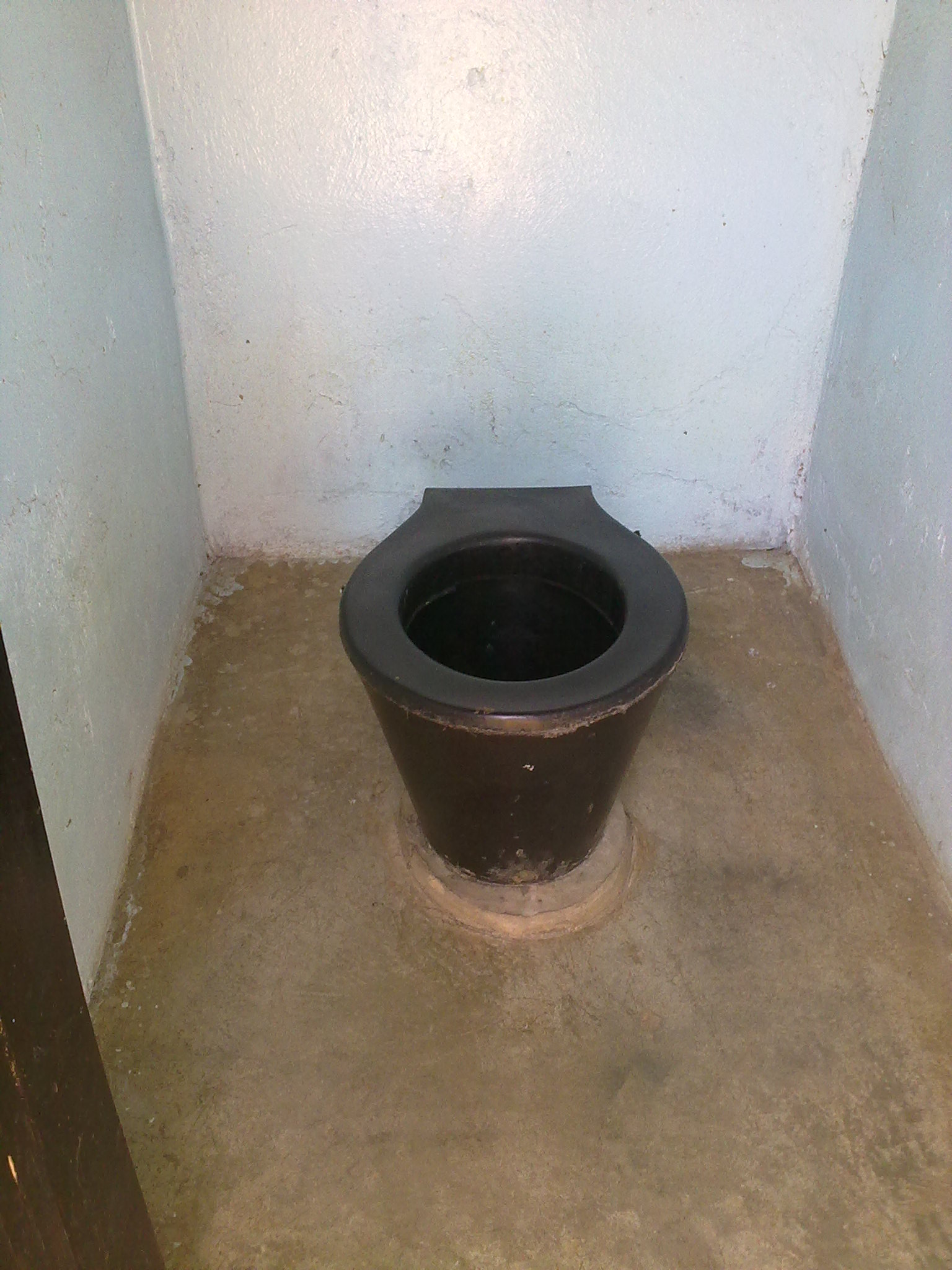 a bathroom with a very dirty toilet inside