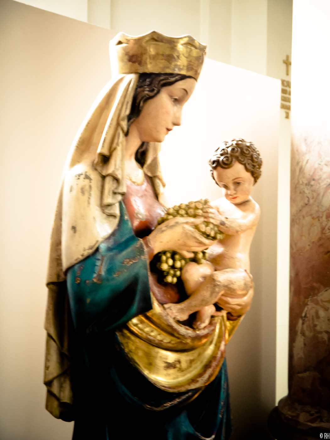 a statue of mary holding the baby jesus