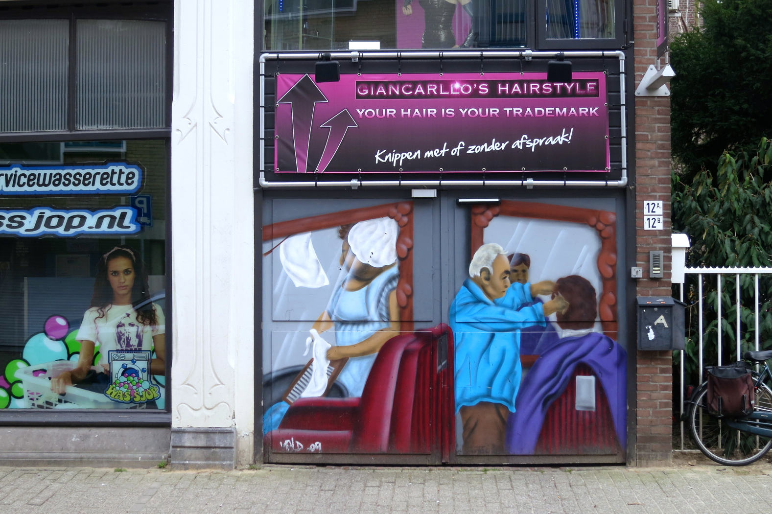 the doorways of the barbers and salon are decorated with murals